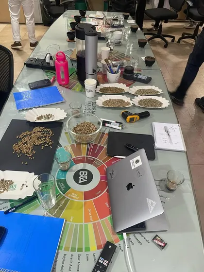 The table is set for a deep dive into coffee roasting and cupping. We lay out everything needed to analyze green beans and their roast profiles.