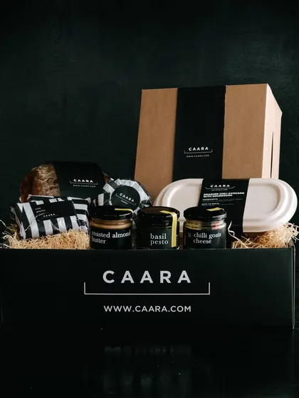 Our signature black box filled with a curated selection of treats for Father's Day. This hamper includes our basil pesto, chilli goat cheese, roasted almond butter, and other gourmet items he is sure to love.