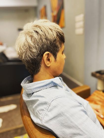 From another angle, you can see the soft texture I created in this short grey hairstyle. It's a perfect example of a sophisticated yet modern haircut.