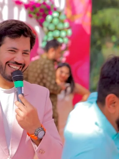 When a photo speaks louder than words. A candid smile captured while hosting a Mehndi carnival, surrounded by the happy faces of the guests.
