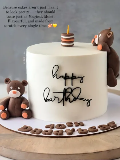 A minimalist cake with cute, handcrafted teddy bears and simple "Happy Birthday" script. This shows that themed cakes can also be simple and elegant.