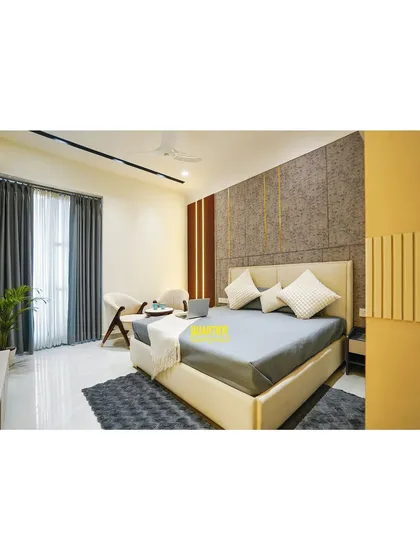 A wider view of the parents' bedroom at Apex D'Rio, showing the complete layout. The design balances warm and cool tones, with a textured accent wall behind the bed and clean lines throughout the furniture.