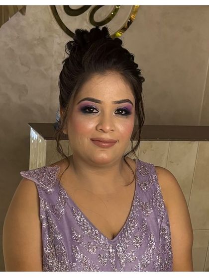 A soft purple smokey eye for this client's party look, paired with a simple and elegant updo.