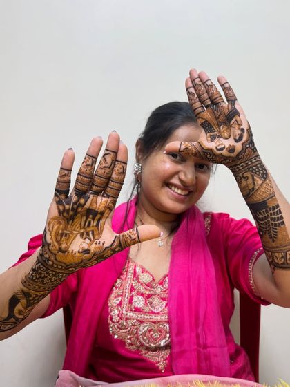 Another happy client proudly displaying her full bridal mehndi. We love capturing these moments of joy.