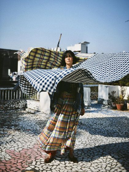Capturing the beautiful movement of hand-loomed fabrics in the breeze. This dynamic shot is full of life and showcases the lightness of the textiles.