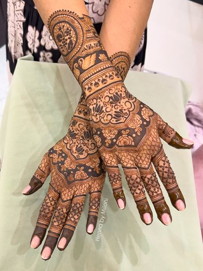 Bookings are open for 2026. This intricate design shows a mix of reverse-fill florals, swans, and delicate net patterns, perfect for the modern bride.