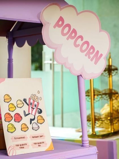 A close-up of the cute signage on our popcorn cart, part of the cohesive decor for a Hello Kitty themed party.