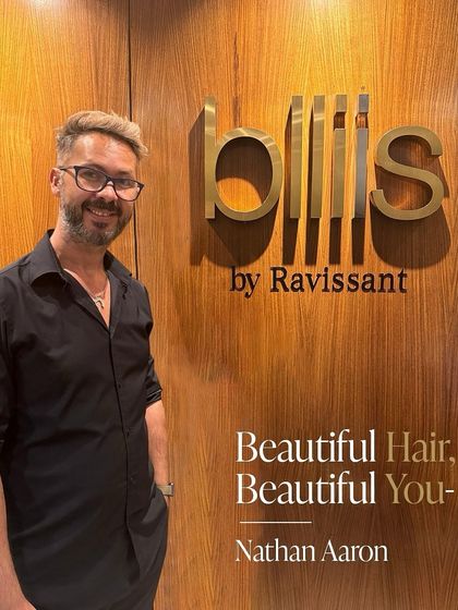 Our Creative Director, Nathan Aaron, believes hair is an expression of individuality. His philosophy of "Beautiful Hair, Beautiful You" guides our team's artistic and personalized approach.