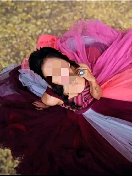 A creative top-down angle of the multi-colored gown. This shot highlights the beautiful blend of colors in the flowing tulle skirt.