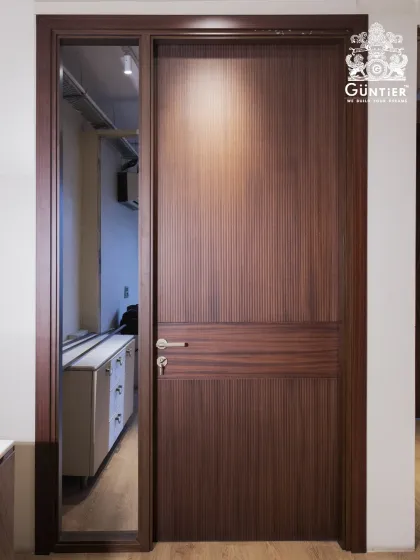 A simple yet elegant veneer door with a horizontal grooved pattern and a side panel with a full-length mirror. This design is not only stylish but also functional, perfect for a bedroom or dressing area.