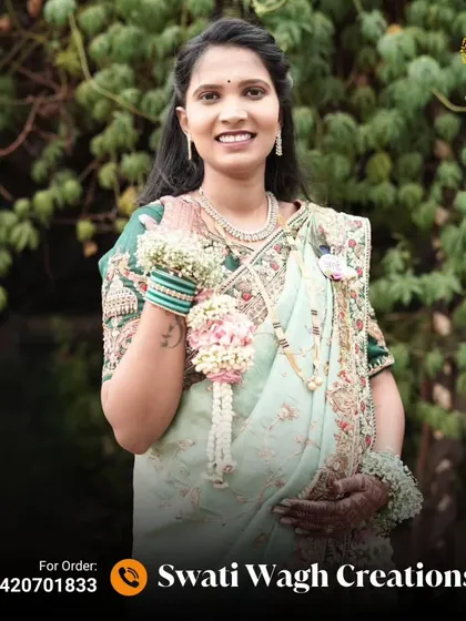 A full view of the mom-to-be with her floral kalire. They are a beautiful symbol of the blessings and good wishes for the new baby.