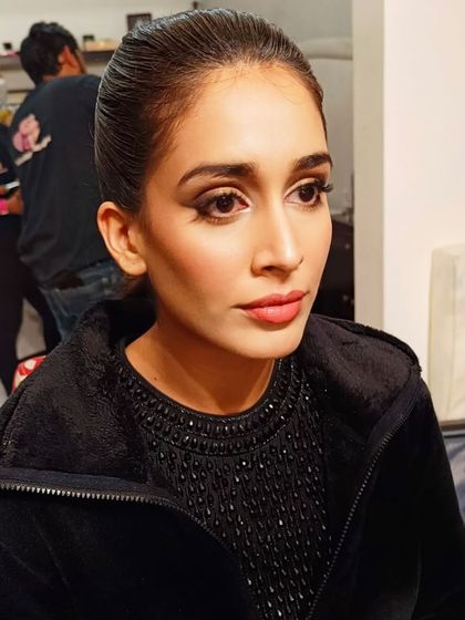 A slightly different angle showing the clean lines of the makeup. This style is perfect for someone who wants a bold, confident look for an evening out.