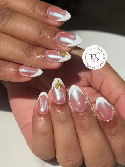 An elegant and trendy "glazed donut" French manicure. The nails have a pearly chrome finish over a sheer base, with clean white tips and a delicate gold charm accent.