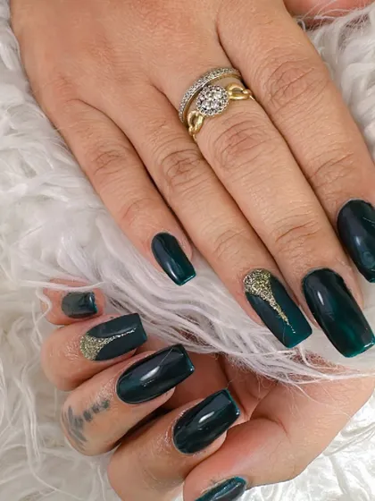 A deep forest green with a subtle marble effect and a touch of gold glitter.