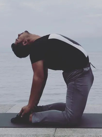 Ustrasana (Camel Pose) facing the sea. This heart-opening pose is about vulnerability and courage.