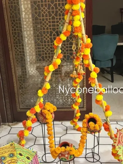 For a home-based Haldi or Mehndi event, I can create beautiful and simple decor elements like this swing. It is decorated with bright orange and yellow marigold garlands, making it a perfect spot for the bride-to-be to sit and take photos.