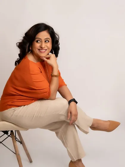 A candid, joyful moment during our session. This image shows her playful side, reminding clients that professionalism can also be warm and full of light.