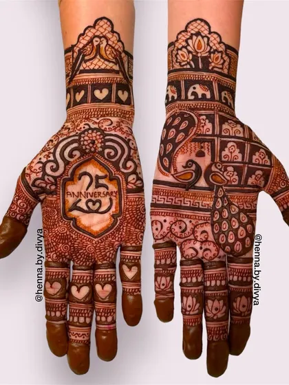 This 25th-anniversary mehendi features the number '25' in a decorative frame. The design is filled with hearts, peacocks, and other royal motifs to celebrate the milestone.