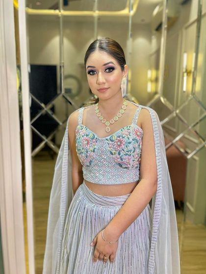 A direct look at the grey sharara set. The pleated pants and embroidered top are a comfortable yet very fashionable rental choice for any celebration.