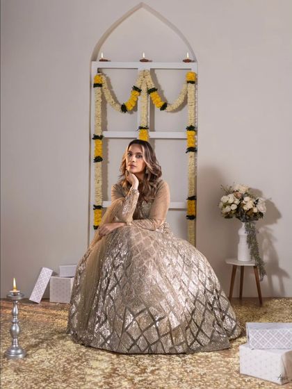 A thoughtful pose amidst the festive setup. This shot showcases the versatility of our studio space, which we can transform to fit any theme, from moody editorials to bright celebrations.