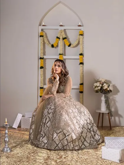 A thoughtful pose amidst the festive setup. This shot showcases the versatility of our studio space, which we can transform to fit any theme, from moody editorials to bright celebrations.