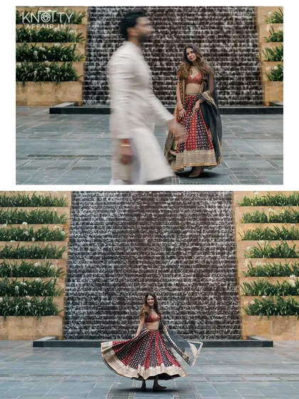 A playful twirl against a stunning waterfall backdrop. This shot captures Malvika's joyful spirit and the beauty of her ajrakh print lehenga, creating a vibrant and lively pre-wedding portrait.