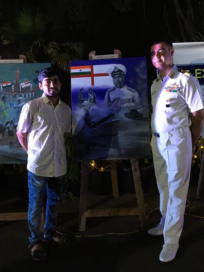 Posing with an Indian Navy officer next to my painting at the INS Hamla exhibition.