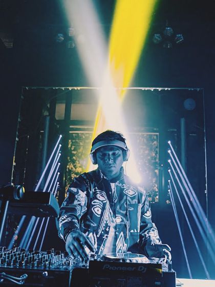 A powerful shot with crossed spotlights, creating a dramatic X effect. The lighting at this gig was perfectly in sync with the music.