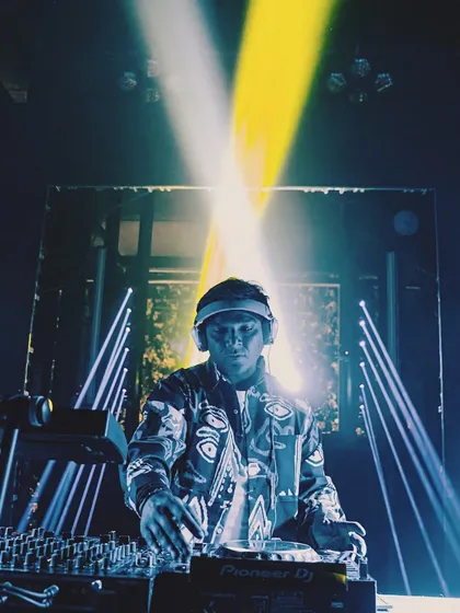 A powerful shot with crossed spotlights, creating a dramatic X effect. The lighting at this gig was perfectly in sync with the music.