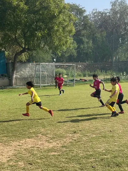 Players in action during a match. Our personalized and age-appropriate programs are designed to unlock each player's full football potential.