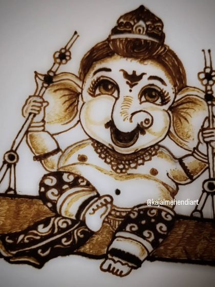 A close-up of the Ganesha portrait. I focus on the cheerful expression and small details like the jewelry and the pattern on his dhoti.