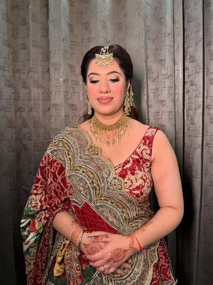 A serene portrait of Samiksha. The soft, blended makeup complements her traditional attire perfectly.