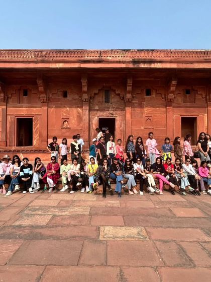 Students from Grades V to VIII pose at the historic Fatehpur Sikri. Our educational trips are carefully planned to align with their curriculum, providing deeper insights into Mughal architecture and history.