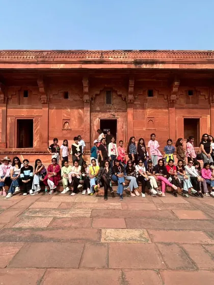 Students pose at another stunning location within Fatehpur Sikri, absorbing the history and grandeur of the Mughal era.