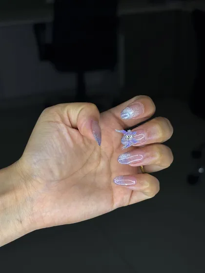 Another angle of the 4D nail perfection, highlighting the glittery ombre effect and the intricate details of the lash art.