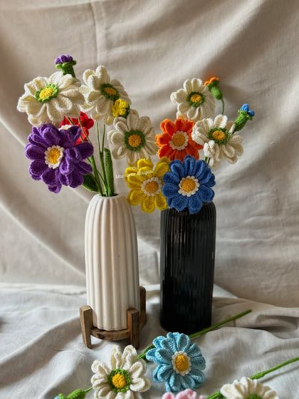 A large, colorful arrangement of our Zianna crochet flowers in various shades. They look stunning grouped together in a mixed bouquet.