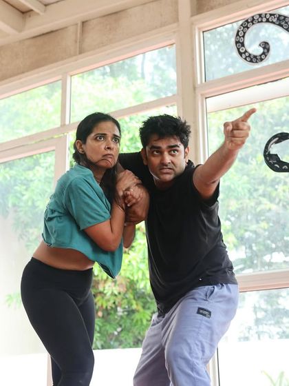 A moment of suspense during a rehearsal for "Gretel." The actors explore the story's darker themes through expressive physical storytelling.