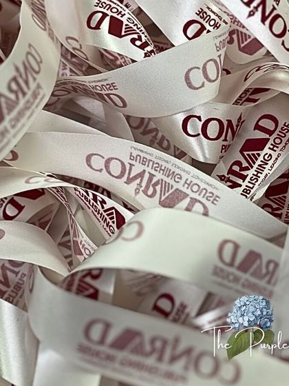 The details make the design. This pile of custom-printed ribbons for Conrad Publishing House shows my commitment to branding every element of a PR gift for a cohesive and professional look.
