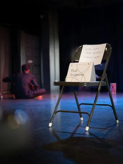 A simple chair on our stage, marked for a "Fluid Sculpture" exercise, showing how even the simplest props can create magic in our black box.