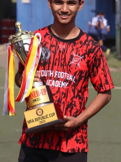 A proud player holds the runner-up trophy from the MFA Republic Cup. Every player gave their all, and we couldn't be prouder of their performance.