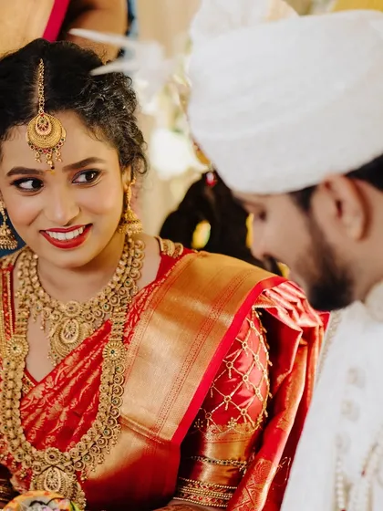 A beautiful candid moment during the wedding. Her makeup looks fresh and radiant, a testament to the skin-focused approach I take.