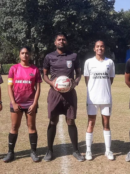 The captains of Noida City FC and She Kicks FA with the match officials before their game in the Women's Championship, representing the spirit of sportsmanship.