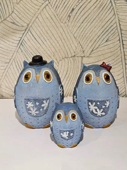 This adorable owl family showpiece in a denim-blue finish is perfect for a study or bedroom.