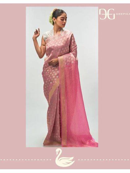 An 'Ashes of Roses' tissue jacquard saree with a vibrant 'Madder Rose' pallu. The subtle, shimmering motifs on the body create a delicate texture, embodying sustainable luxury bridal wear.
