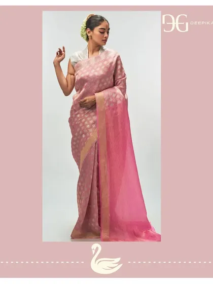 This opulent tissue jacquard saree in 'Ashes of Roses' is a picture of grace. The subtle color is enhanced by the shimmer of the tissue fabric and a contrasting madder rose pallu, designed for the modern bride.