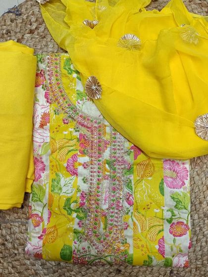 This sunny yellow suit piece, complete with a gota patti dupatta, is a gift as precious as her love.