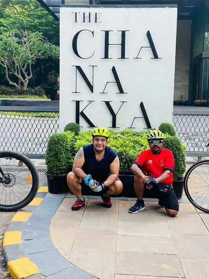 Our cyclists posing in front of The Chanakya. We love exploring the upscale and iconic parts of Lutyens' Delhi on our rides.