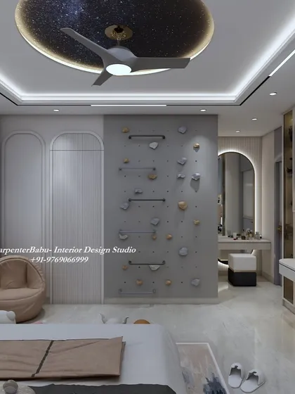 A view of the rock-climbing wall and the dressing table, showing how the room is designed for both play and practicality.