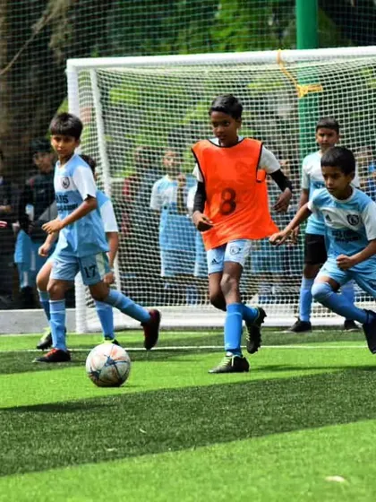 The thrill of the game in full swing. Our young players learn to compete, tackle, and chase every ball with passion and focus during an intense practice match.