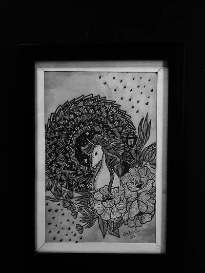 A whimsical drawing of a unicorn surrounded by flowers, with its mane created from a beautiful mandala pattern.